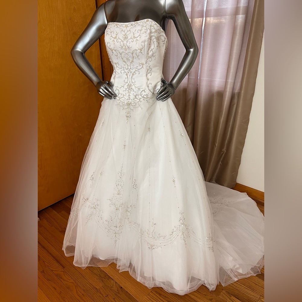 David's Bridal White Strapless Ball Gown style v9675 with matching vail.
